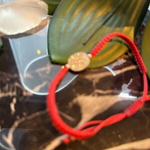 Elegant Red Bracelet with Sparkling Centerpiece